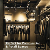 Clothing store interior with racks of clothes and a mirror