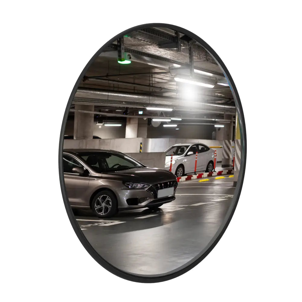 Convex mirror showing a parking garage with cars
