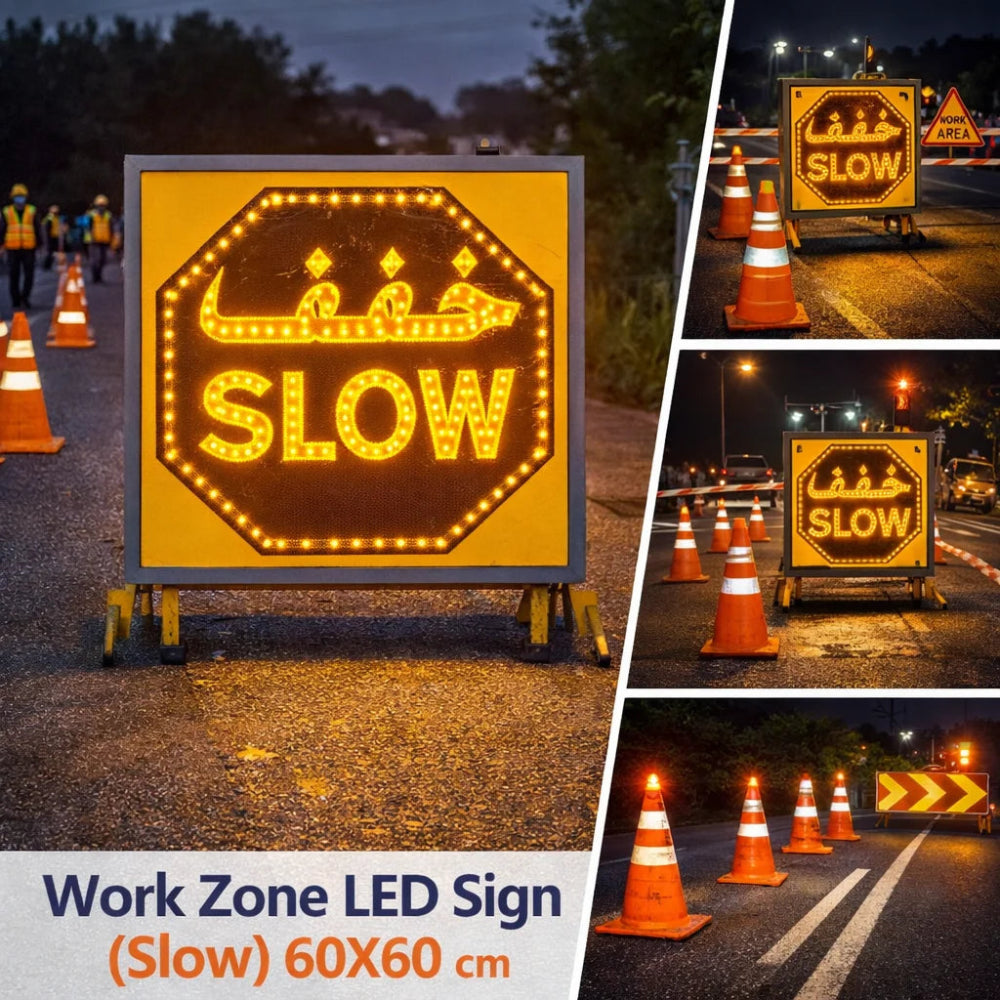 work zone LED signs with 'SLOW' text, surrounded by traffic cones and construction workers.