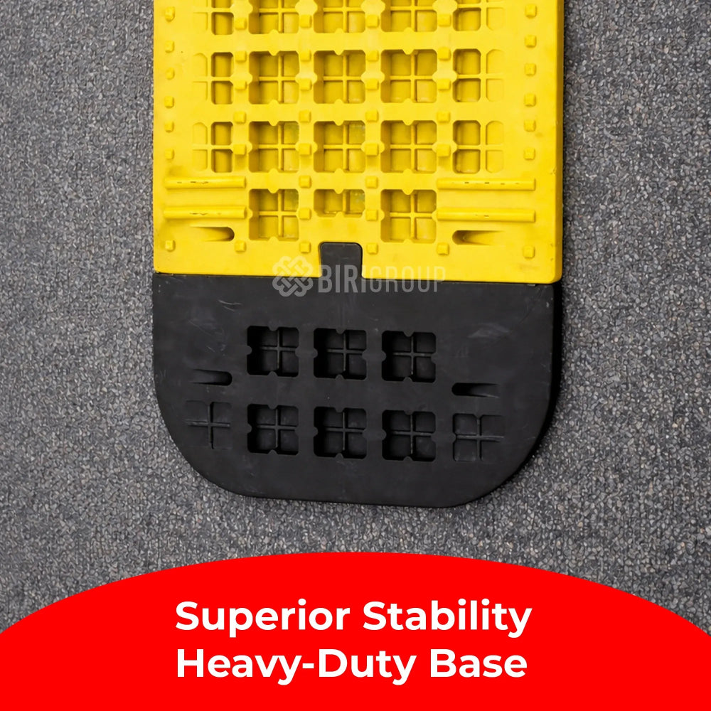 Yellow and black speed bump with branding on a gray surface, featuring text about stability.