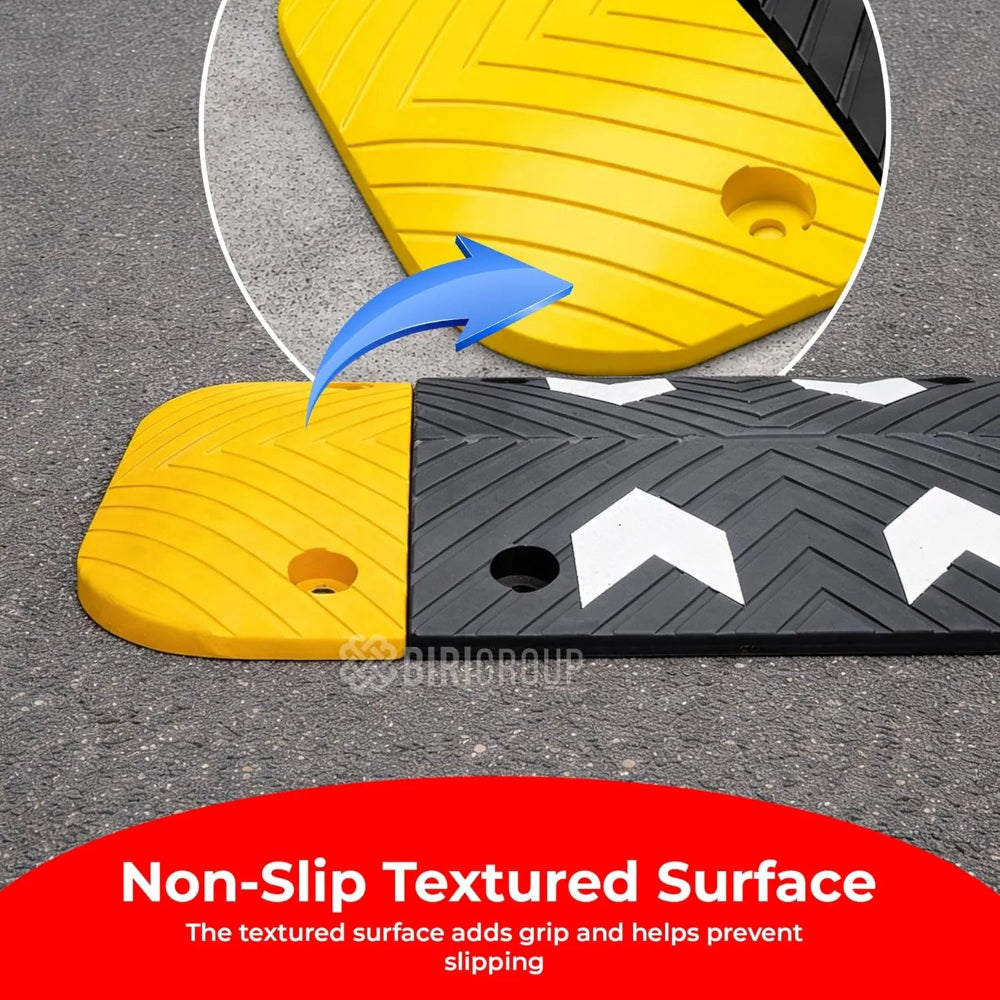 Yellow and black speed bump with non-slip textured surface
