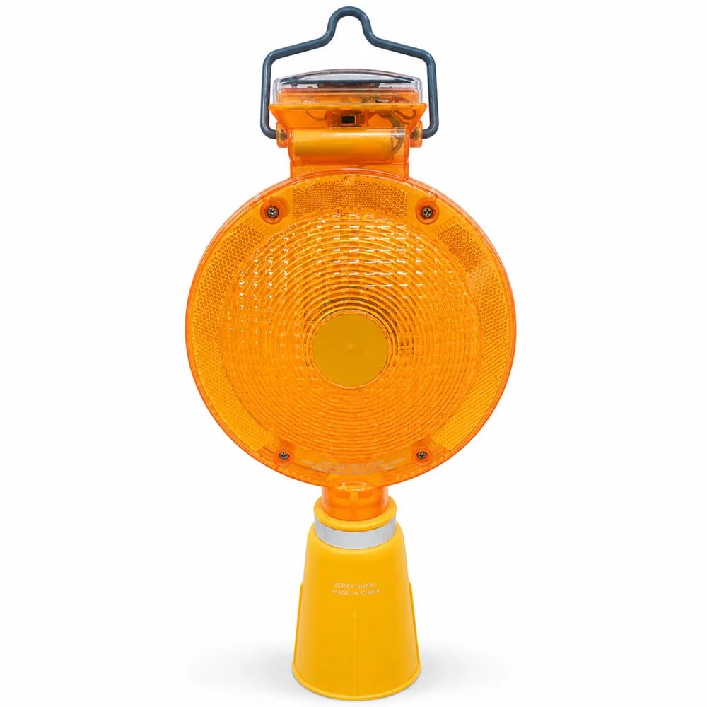 Orange solar powered LED traffic cone warning light for road safety and visibility