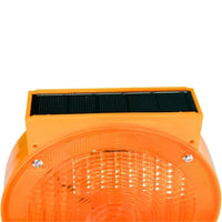 Orange solar panel with black solar cells on a white background