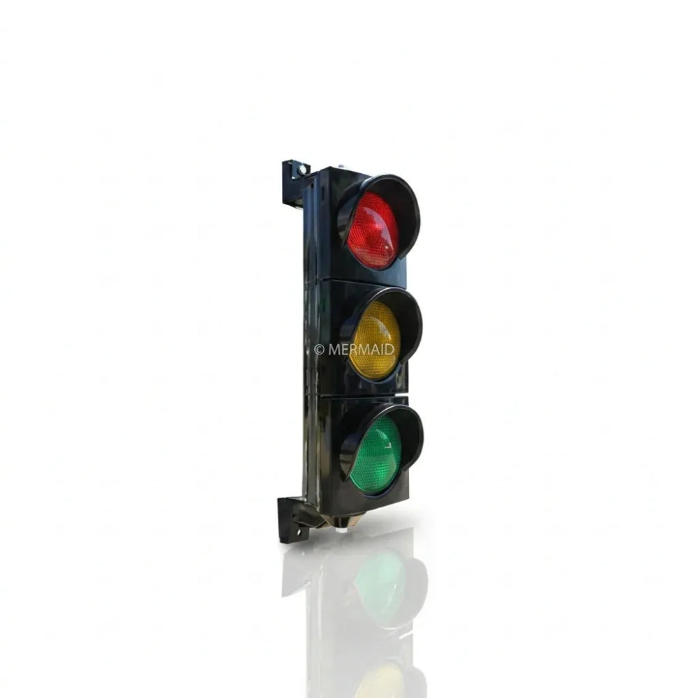 Traffic light with red, yellow, and green lights on a white
