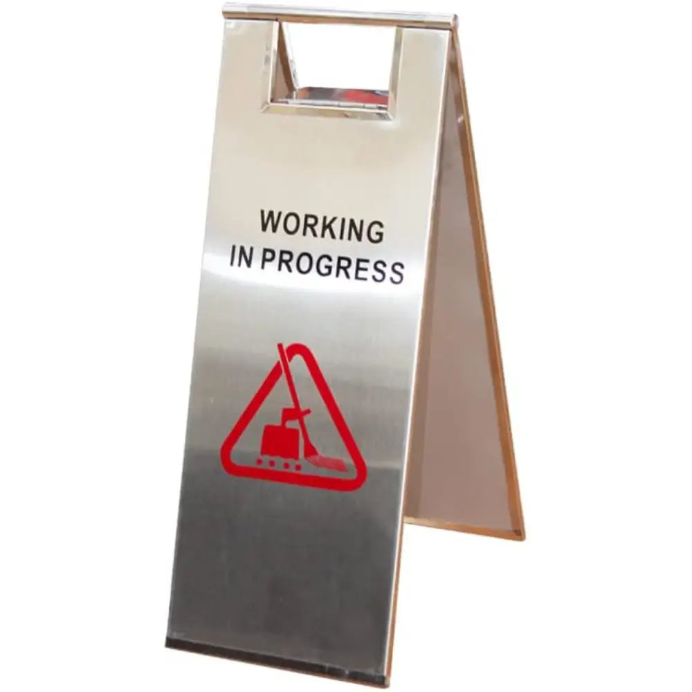 Metal sign with 'Working in Progress' and warning symbol