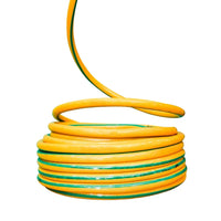 Coiled yellow and green garden hose 