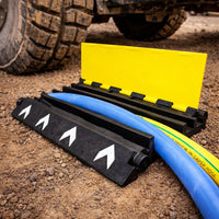 Ramp on a dirt surface next to a vehicle tire