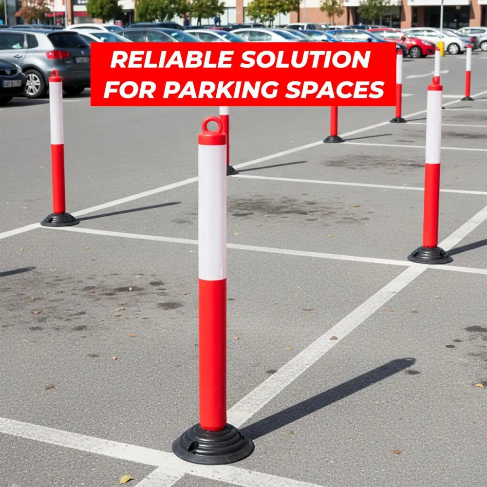 Red and white parking barriers in a parking lot 