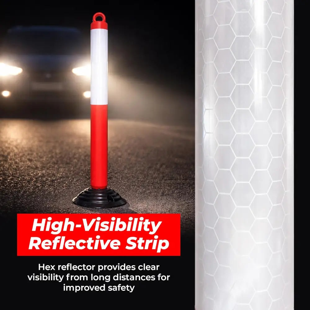 High-visibility reflective strip on a road with a car's headlights 