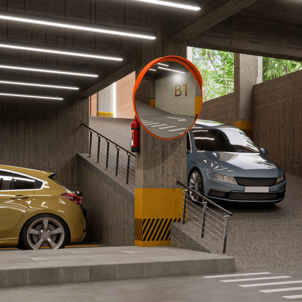 Underground parking garage with cars and a mirror 