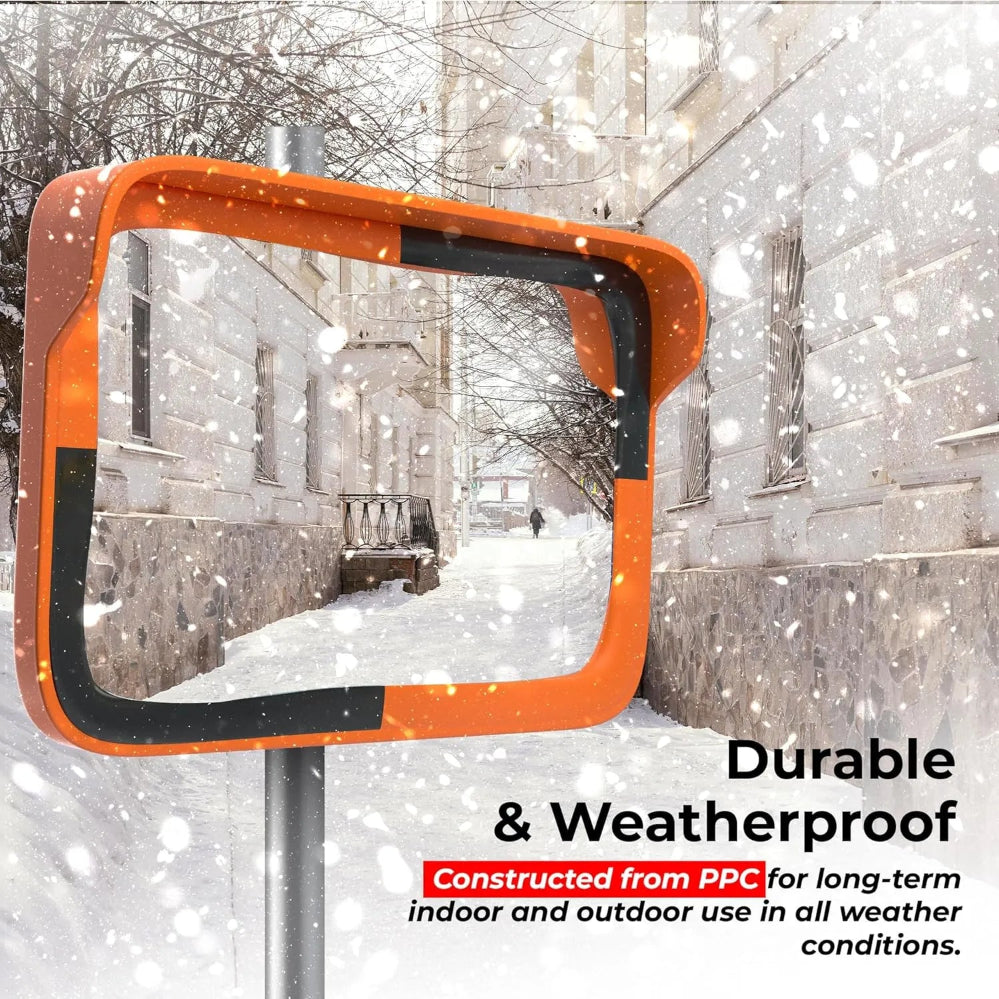 Orange and black rectangular mirror in a snowy urban setting