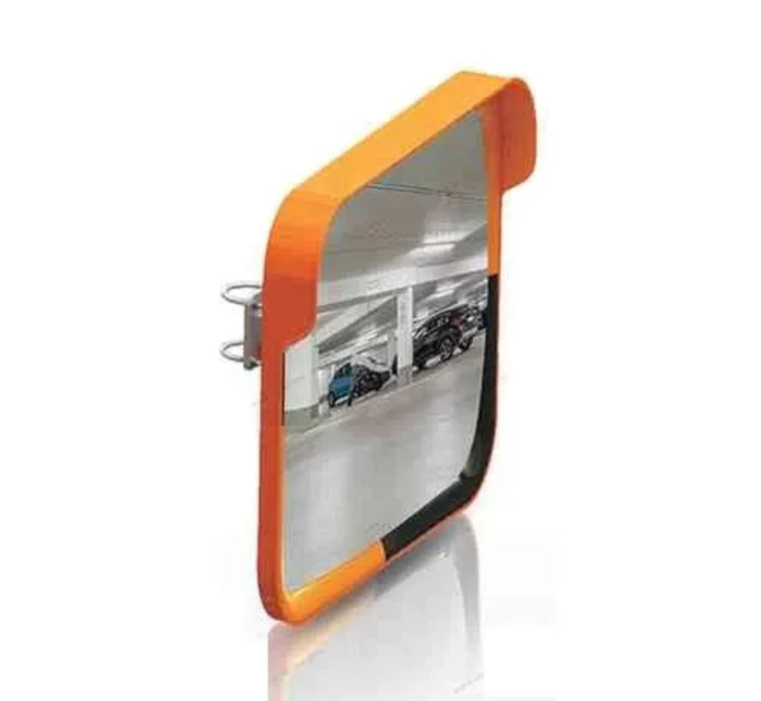 Convex mirror with orange frame reflecting a parking garage