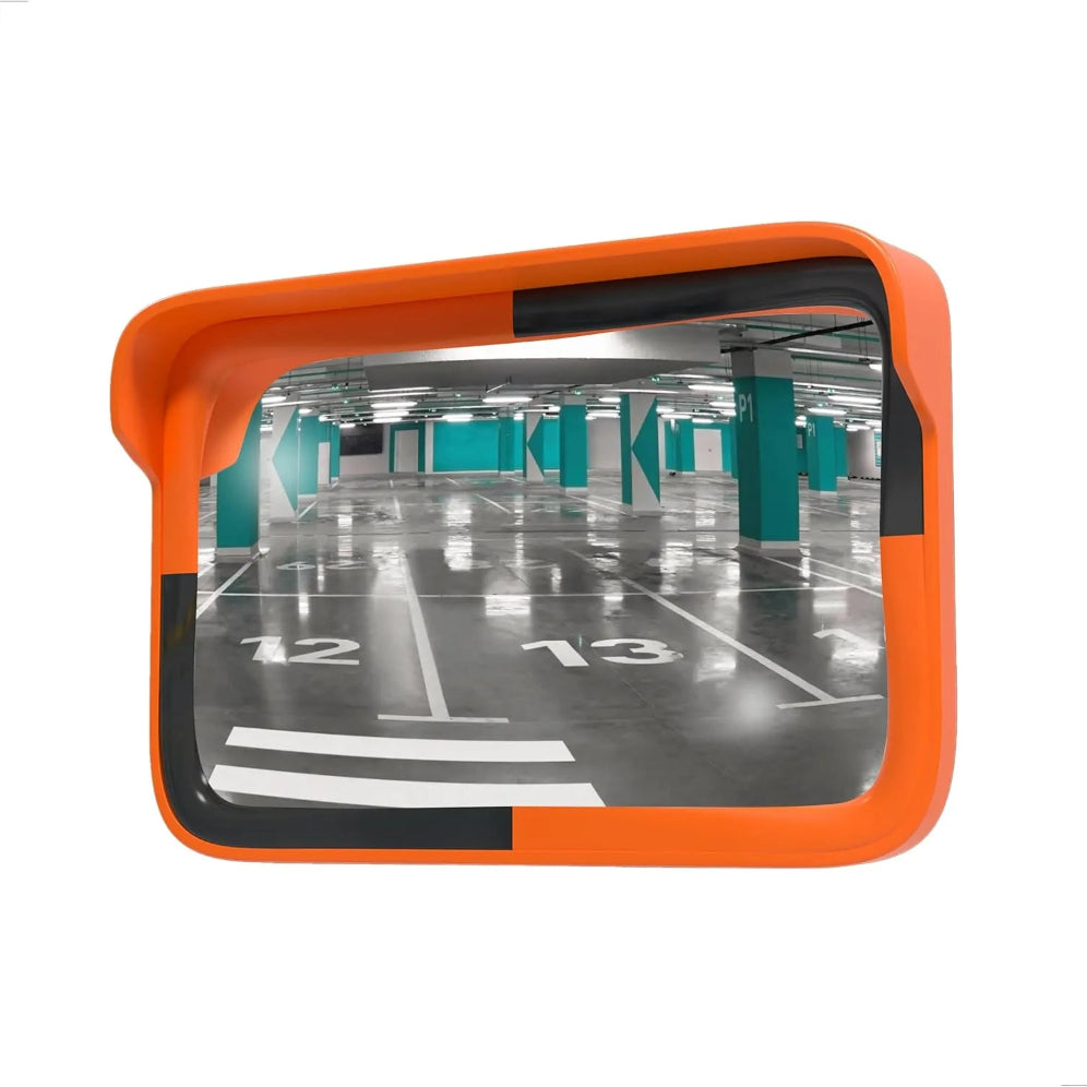 Orange safety mirror showing a parking garage