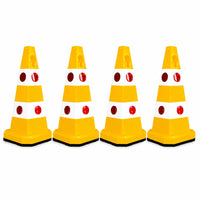Four yellow and white plastic traffic safety cones 