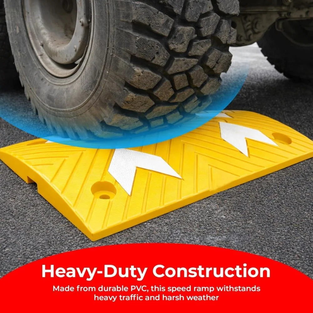 Yellow speed ramp with a tire on top, labeled 'Heavy-Duty Construction' on a red background.