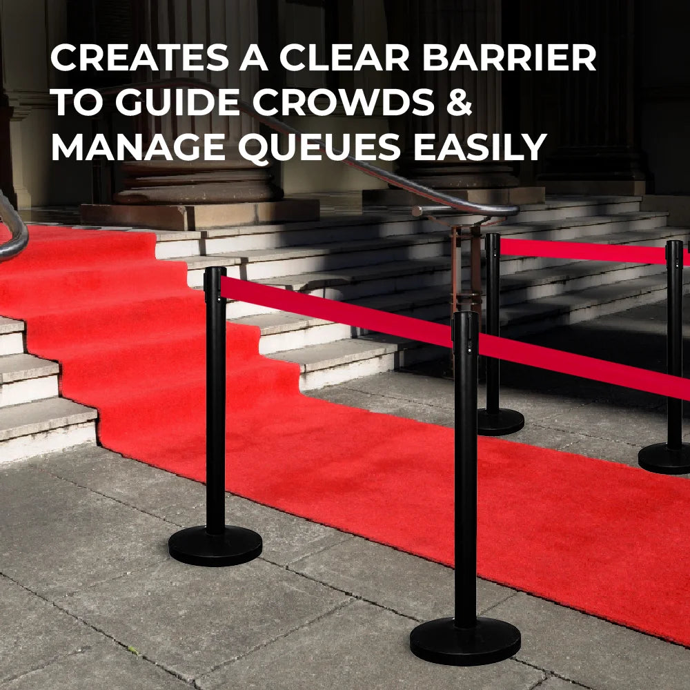 Red carpet with black stanchions guiding crowds,