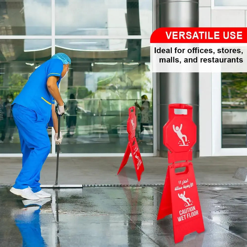 Person cleaning a wet floor with red safety cones and a sign indicating versatile use for offices, stores, malls, and restaurants.
