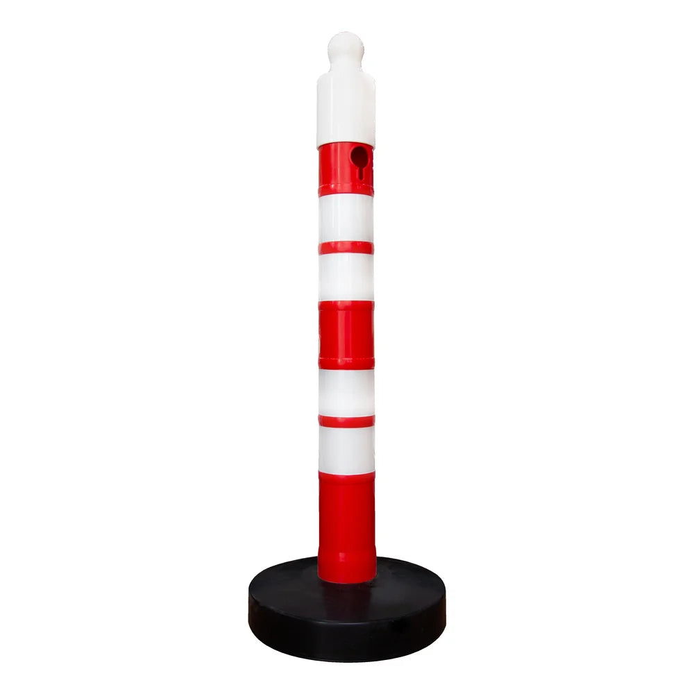 Red and white striped traffic post with black base on a white background