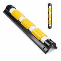 Yellow and white traffic barrier with black base on a white background