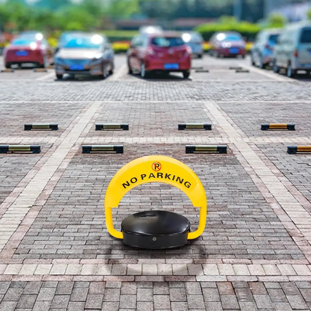 Yellow 'No Parking' sign on a brick pavement with cars in the background