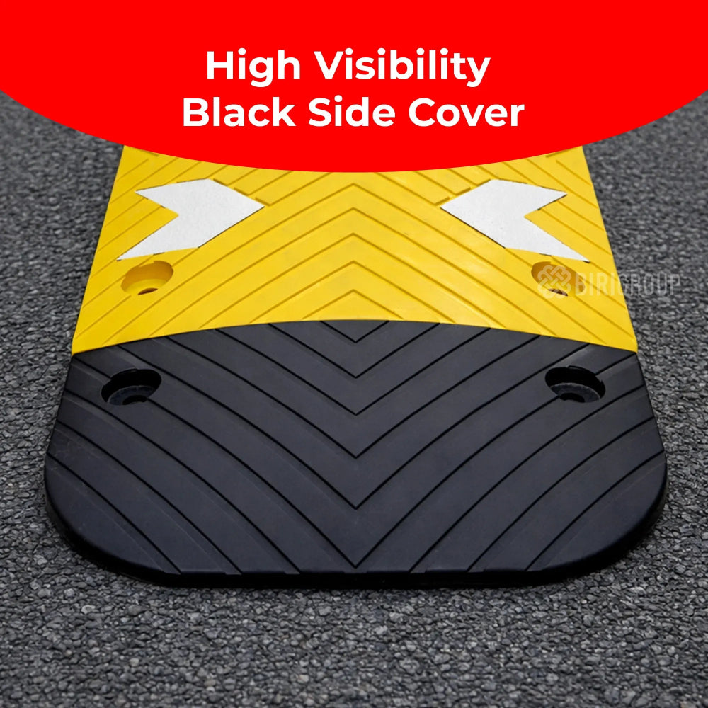 High visibility black side cover with yellow center on a textured surface