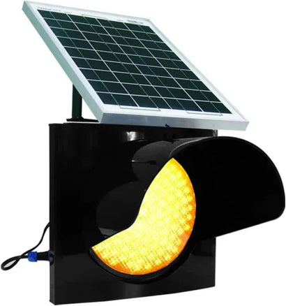 Solar-powered traffic light with a yellow warning light on a white background