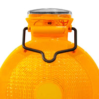 Close-up of a yellow safety light with a black handle on a white background