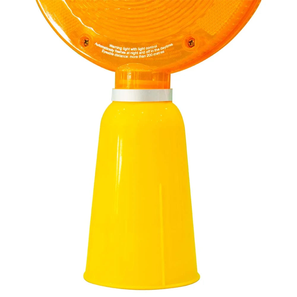 Yellow and orange warning light on a white background
