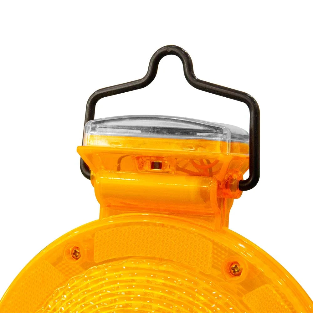 Yellow safety light with black handle on a white background