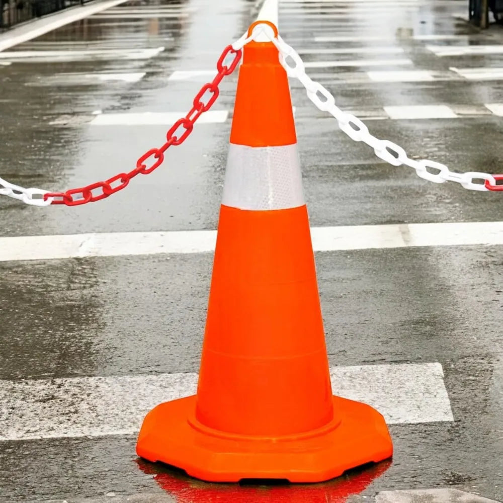 Orange traffic cone with reflective stripes and plastic chain.