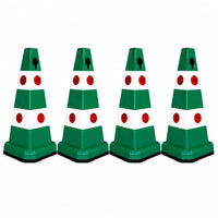 Four green and white plastic traffic safety cones 