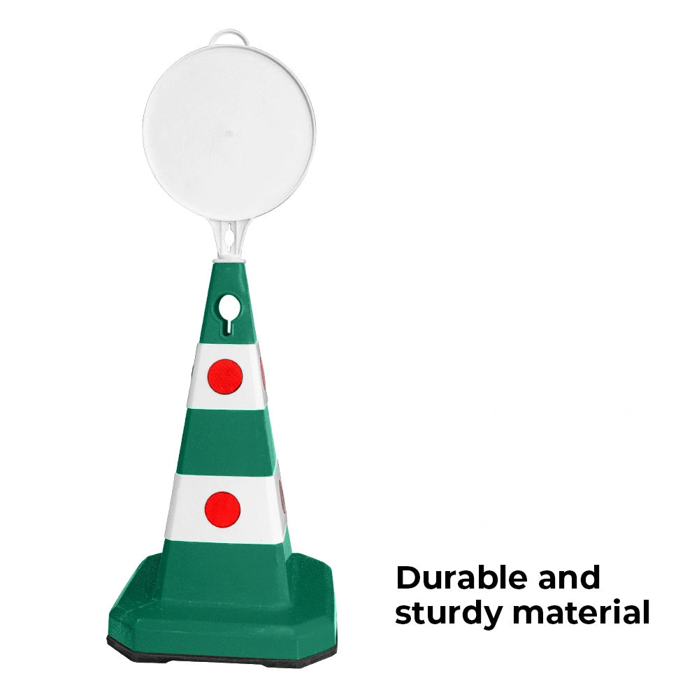 A green and white traffic safety cone .