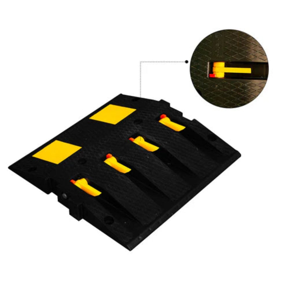 Black and yellow speed bump with close-up spike on a white background